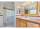 Bright bathroom featuring a glass-enclosed shower, vanity, and granite countertops at 13843 Poppleton Ct, Charlotte, NC 28273