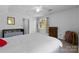 Bright bedroom with crib, window, and plenty of space for a growing Gathering at 13843 Poppleton Ct, Charlotte, NC 28273