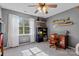 Bedroom features natural light, carpet, and decor shelving for creative decorating at 13843 Poppleton Ct, Charlotte, NC 28273
