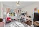Bright bedroom with pink accents, including chair, curtains, and desk accessories at 13843 Poppleton Ct, Charlotte, NC 28273