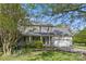 Charming two-story home features a welcoming front porch, attached garage, and well-maintained lawn at 13843 Poppleton Ct, Charlotte, NC 28273