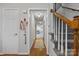 Welcoming foyer features wood flooring, a carpeted staircase, and access to multiple rooms at 13843 Poppleton Ct, Charlotte, NC 28273