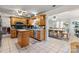 Eat-in kitchen features oak cabinets, stainless steel appliances, and an adjacent dining area at 13843 Poppleton Ct, Charlotte, NC 28273