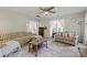 Cozy living room is filled with natural light and features comfortable seating and neutral décor at 13843 Poppleton Ct, Charlotte, NC 28273