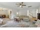 Inviting living room is filled with natural light and features plush seating and a ceiling fan at 13843 Poppleton Ct, Charlotte, NC 28273