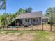 A beautiful backyard featuring a pool, patio furniture, and a black metal fence surrounding the property at 143 Robinson Ridge Dr, Mooresville, NC 28117