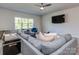 Cozy living room with a plush gray sofa, window and modern furnishings at 143 Robinson Ridge Dr, Mooresville, NC 28117