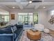 Open-concept living room with hardwood floors, and a view into the screened-in porch at 143 Robinson Ridge Dr, Mooresville, NC 28117