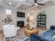 Cozy living room with fireplace, ceiling fan, recessed lighting and an area rug at 143 Robinson Ridge Dr, Mooresville, NC 28117