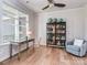 Bright office space featuring a large window, hardwood floors, modern desk and a comfortable chair at 143 Robinson Ridge Dr, Mooresville, NC 28117