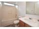 Bathroom showcases a vanity and shower-tub combo, exuding practical functionality at 14608 Arlandes Dr, Charlotte, NC 28278