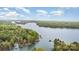Breathtaking aerial view of lakefront properties surrounded by lush forests with private docks and boat houses at 147 Spring Shore Rd, Statesville, NC 28677