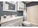 Bathroom with vanity, mirror, and storage shelving over the toilet at 147 Spring Shore Rd, Statesville, NC 28677