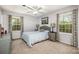 Comfortable bedroom with a bed, neutral colors, and windows providing plenty of natural light at 147 Spring Shore Rd, Statesville, NC 28677