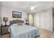 Neutral primary bedroom with cozy decor, two closets, and a ceiling fan at 147 Spring Shore Rd, Statesville, NC 28677