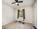 Simple bedroom with neutral walls, carpet, and a window for natural light; exercise equipment is present at 147 Spring Shore Rd, Statesville, NC 28677