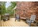 Outdoor deck with a grill and seating, perfect for entertaining and enjoying the outdoors at 147 Spring Shore Rd, Statesville, NC 28677