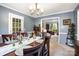 Dining room showcasing views into the living room, neutral paint, and room for entertainment at 147 Spring Shore Rd, Statesville, NC 28677