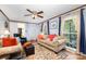 Sunlit living room with hardwood flooring, and ample seating at 147 Spring Shore Rd, Statesville, NC 28677