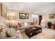 Comfortable living room with neutral tones, plush seating, and tasteful decor throughout the space at 147 Spring Shore Rd, Statesville, NC 28677