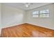 Bright bedroom with hardwood floors and natural light from a double window at 165 Northwest Rd, Hickory, NC 28601