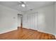 Bedroom featuring laminate flooring, a ceiling fan, and a closet at 165 Northwest Rd, Hickory, NC 28601