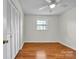 Bedroom featuring laminate flooring, a ceiling fan, and a closet at 165 Northwest Rd, Hickory, NC 28601