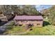 Charming brick home with a metal roof and well-manicured front lawn at 165 Northwest Rd, Hickory, NC 28601