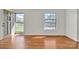 Sun-filled living room with hardwood floors and neutral paint at 165 Northwest Rd, Hickory, NC 28601