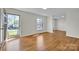 Bright living room featuring newly refinished hardwood flooring at 165 Northwest Rd, Hickory, NC 28601