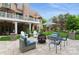Stunning backyard patio area with a fire pit, comfortable seating, and professional landscaping, perfect for outdoor entertaining at 1813 Wedowee Ct, Rock Hill, SC 29732