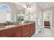 Bathroom with granite countertops, dual sinks, large mirror, and a view of the walk-in shower at 1813 Wedowee Ct, Rock Hill, SC 29732