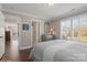 Bright bedroom with large windows, shutters, and a cozy bed with a grey and white blanket at 1813 Wedowee Ct, Rock Hill, SC 29732