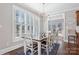 Bright dining room with plantation shutters and view into adjacent sitting room at 1813 Wedowee Ct, Rock Hill, SC 29732