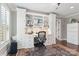 Bright home office with custom built-ins, desk, and hardwood floors with an area rug at 1813 Wedowee Ct, Rock Hill, SC 29732