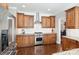 Modern kitchen with stainless steel appliances, granite countertops, and custom cabinets at 1813 Wedowee Ct, Rock Hill, SC 29732