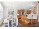 Open-concept kitchen flowing into dining area with stainless steel appliances and custom cabinetry at 1813 Wedowee Ct, Rock Hill, SC 29732