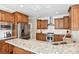 Bright kitchen featuring stainless steel appliances, granite countertops, and center island at 1813 Wedowee Ct, Rock Hill, SC 29732