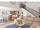 Spacious living room with open floor plan, staircase, and dining area, providing ample natural light at 1813 Wedowee Ct, Rock Hill, SC 29732