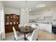 Charming eat-in kitchen with white cabinets and a built-in china cabinet at 19416 Fridley Ln, Cornelius, NC 28031