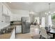 Bright, open concept kitchen and dining area featuring stainless steel refrigerator at 19416 Fridley Ln, Cornelius, NC 28031