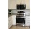 Well-equipped kitchen featuring stainless steel appliances and white cabinets at 19416 Fridley Ln, Cornelius, NC 28031