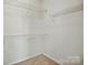 Walk-in closet with wire shelving for ample storage space at 19416 Fridley Ln, Cornelius, NC 28031