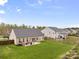 A well-manicured backyard featuring a patio with canopy and an expansive lawn at 2077 Taney Way, Fort Mill, SC 29707