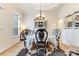 Elegant dining room with a round table, decorative hutch, and natural light creates a sophisticated ambiance at 2077 Taney Way, Fort Mill, SC 29707