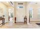 Welcoming foyer featuring hardwood floors, a bright entryway, and views of adjacent rooms at 2077 Taney Way, Fort Mill, SC 29707