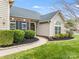 Welcoming front entrance featuring a garden, walkway, and a charming brick facade with large windows at 2077 Taney Way, Fort Mill, SC 29707