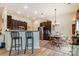 Open concept kitchen featuring barstool seating, stainless steel appliances, and a cozy dining area at 2077 Taney Way, Fort Mill, SC 29707