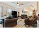 Relaxing living room features plush seating, ceiling fan, and ample natural light for a comfortable and inviting space at 2077 Taney Way, Fort Mill, SC 29707