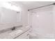 Bathroom showcasing a large mirror and tub at 212 Pine St, Rockwell, NC 28138